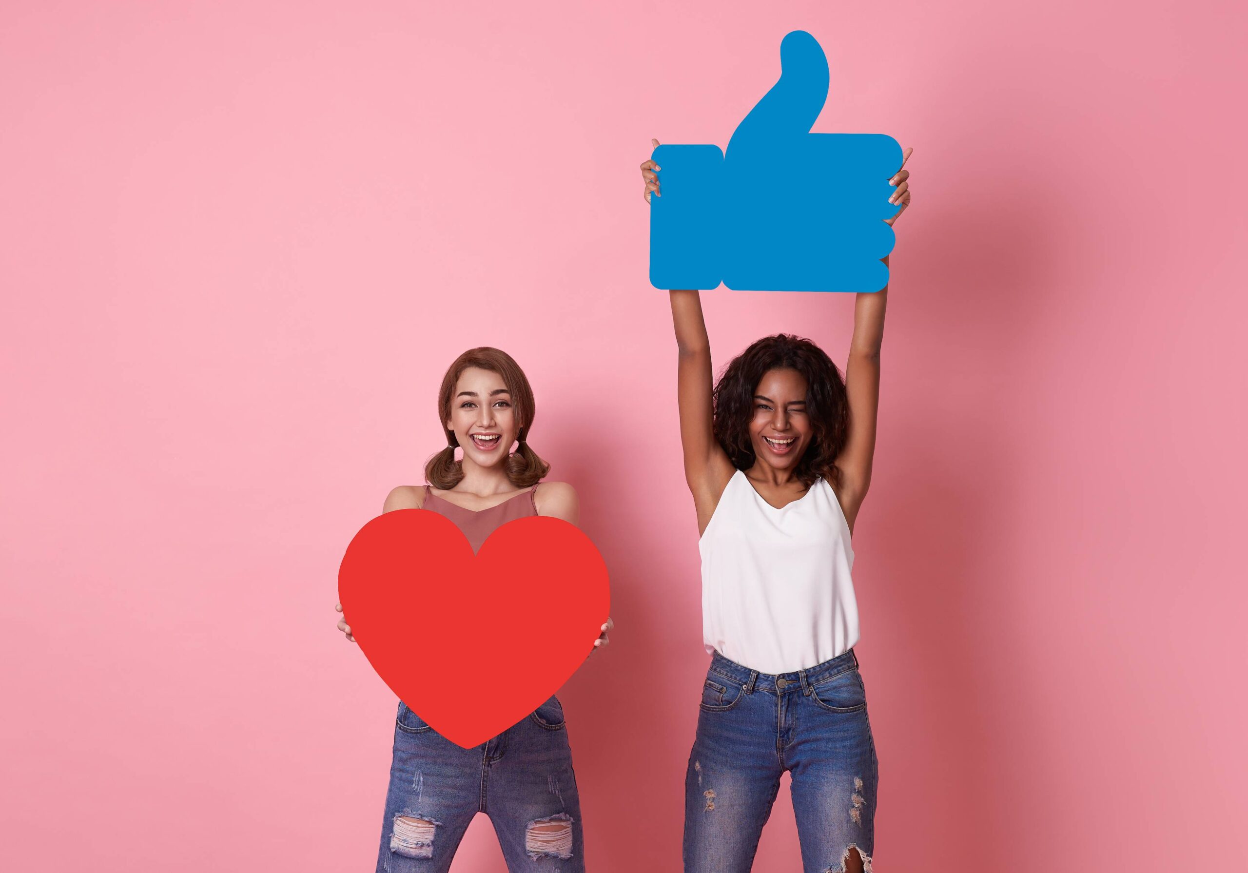 Two people celebrating Meta and other social media react buttons